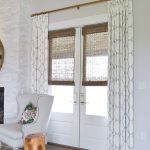 patterned curtains and bamboo shades for style and privacy .