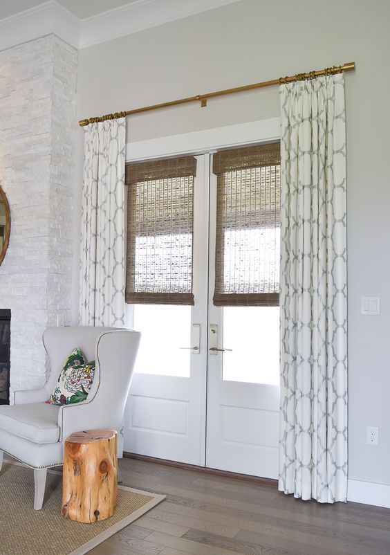 patterned curtains and bamboo shades for style and privacy .