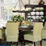 Lovely dining room. Love the green slip covers. Great rug and .