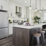 Gather at the island in Mesa's central galley kitchen | Calgary Hera