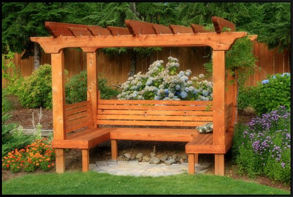 Lovely arbor with a built-in bench. This isn't exactly the kind of .