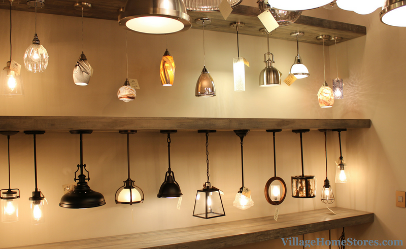 Creative pendant lighting display wall in Village Home Stores .