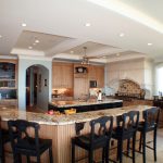 The Kynochs Kitchen: large kitchen island with seating and storage .