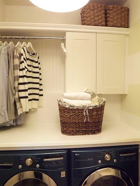 add a cabinet, shelf, and rod, and you have instant laundry room .