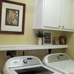 Laundry room ideas - cabinet, shelf, and hanging rod. I like this .