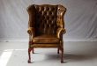 Use and types of leather wingback chair with nailhead trim .