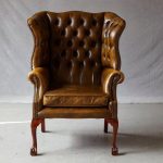 Use and types of leather wingback chair with nailhead trim .