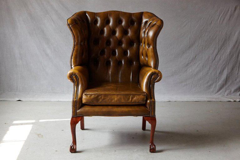 Use and types of leather wingback chair with nailhead trim .