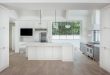 Some tips to clean and care of modern white kitchens with wood .