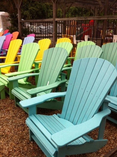 A rainbow of recycled plastic Adirondack chairs from The Cottage .