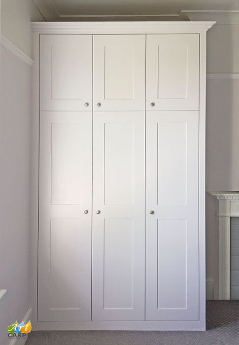 Shaker style bedroom fitted wardrobe, painted white eggshell .