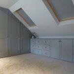 Fitted wardrobes built into loft conversion. Storage drawer units .