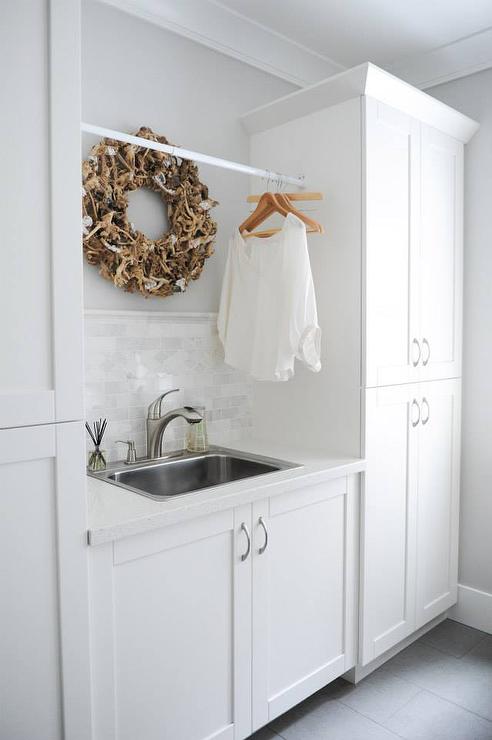 Laundry Room Sink Flanked by Stacked Cabinets - Transitional .