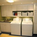 White Cabinet laundry room with Si