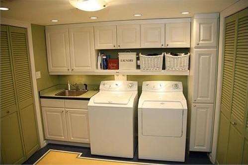 White Cabinet laundry room with Si