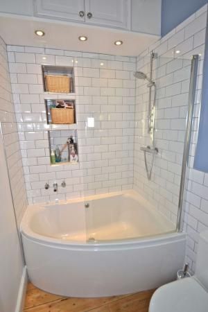 simple corner tub/shower combo in small bathroom | Tiny house .