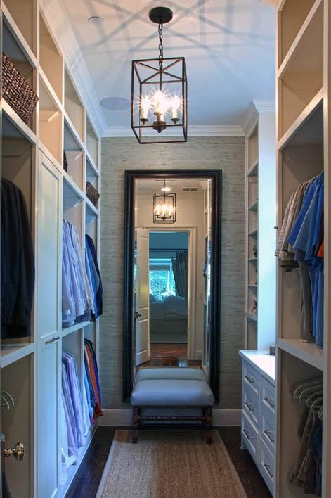 Skinny walk-in closet footprint with long standing mirror at the .