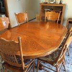 Solid Oak Oval/Round Dining Room Set w/6 Chairs. Table is 48 round .