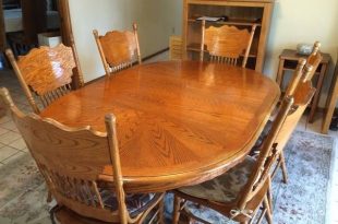 Solid Oak Oval/Round Dining Room Set w/6 Chairs. Table is 48 round .