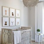 Weathered White Beaded Nrrsery Chandelier Over Gray Wood Crib .