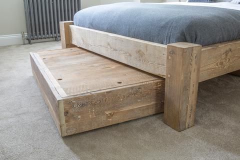 Keeping the bedroom tidy with wooden under bed storage drawers .