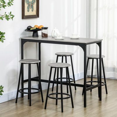 Enhance Your Dining Experience with a Stylish Bar Height Table and Chairs Set