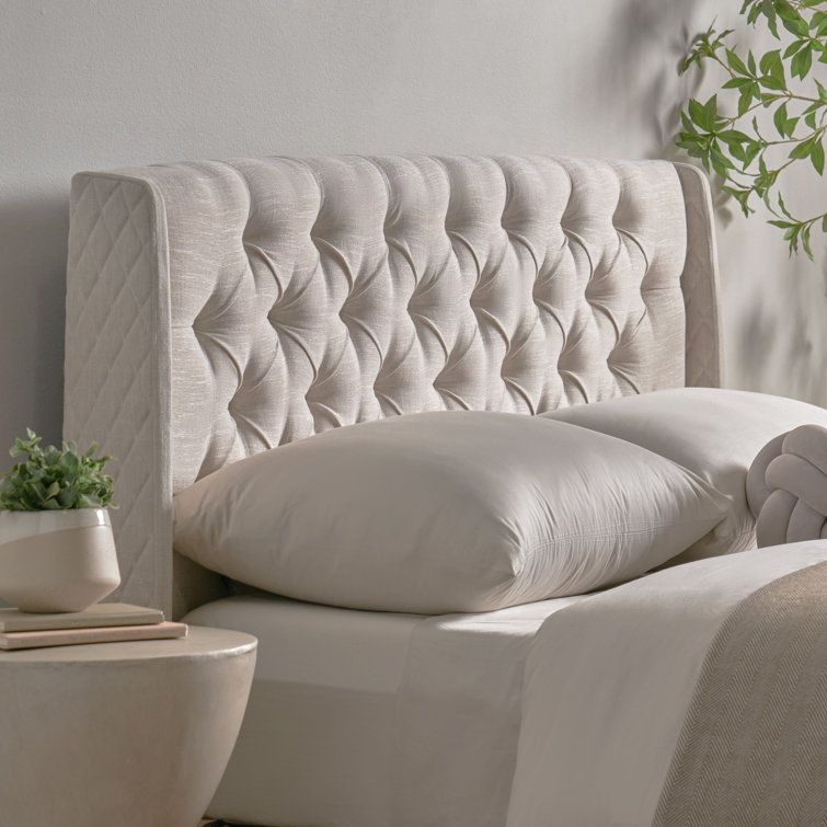 The Luxurious Appeal of a Tufted Upholstered Headboard Fit for a King